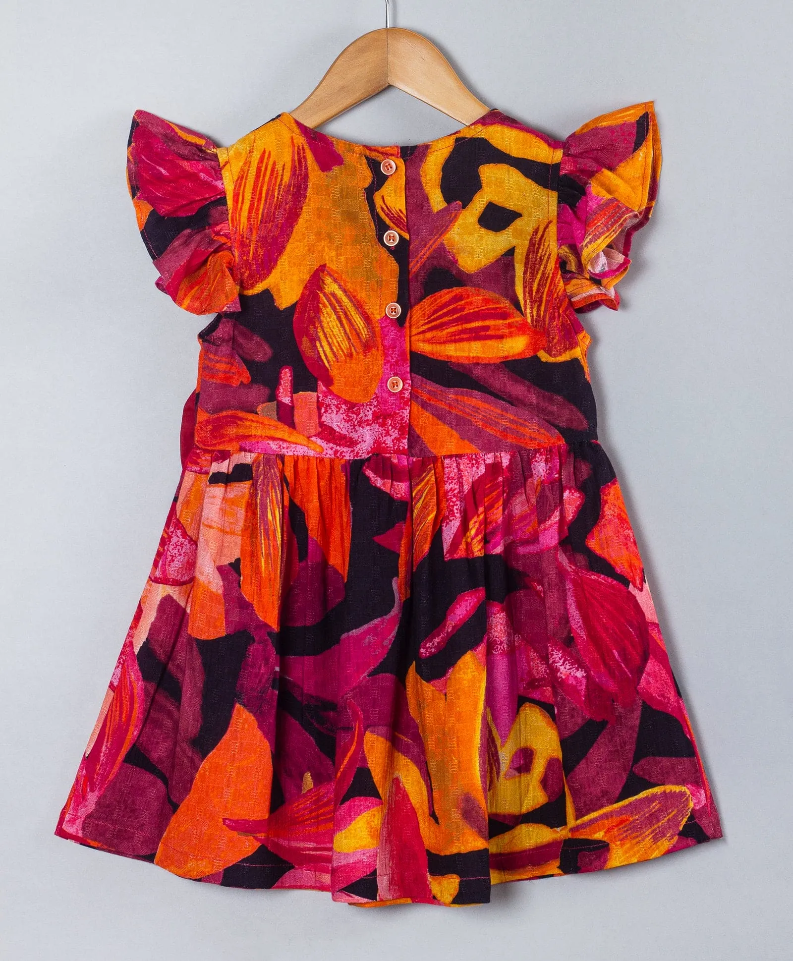 Bold print dress with bows at front waist sides-Burnt orange